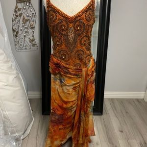 Size L beaded and 100% silk dress.